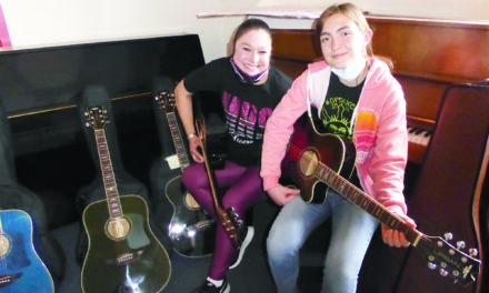 Magdalena music students play Urban guitars